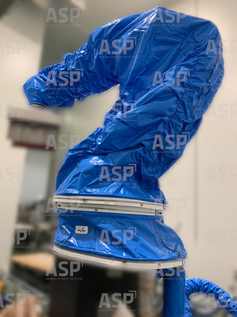 The robot is protected by a blue ASP cover inside a cold chamber.